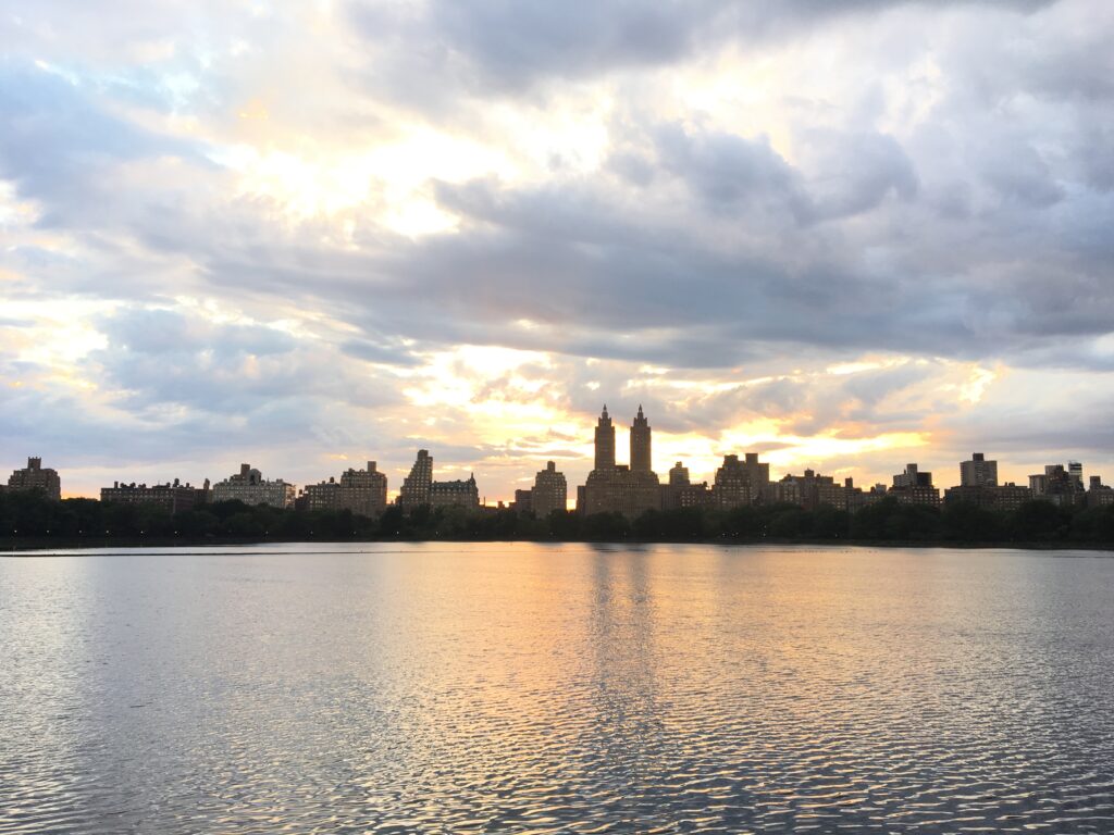 View of the Upper West Side of Central Park as the sun sets.